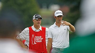 Dustin Johnson, right, waits on the first hole with his former caddie Joe LaCava at last week's The Tour Championship at East Lake.