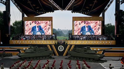 Mr Trump on screen, as members of the military march during the US Army's 250th Anniversary Parade in Washington DC in 2025. Getty Images