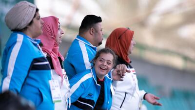 Spectators cheer the runners at Special Olympics World Games athletics competition at Dubai Police Academy Stadium. Reem Mohammed / The National
