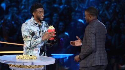 Chadwick Boseman, left, gives his best hero award for his role in 'Black Panther' to James Shaw Jr., who is credited with saving lives during a shooting at a Waffle House in Tennessee at the MTV Movie and TV Awards AP