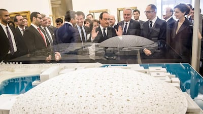 Sheikh Abdullah and Francois Hollande look at a scale model of Louvre Abu Dhabi. Christophe Petit Tesson / AFP
