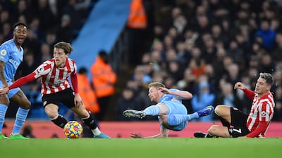 Sergi Canos, right, of Brentford challenges Kevin De Bruyne. EPA