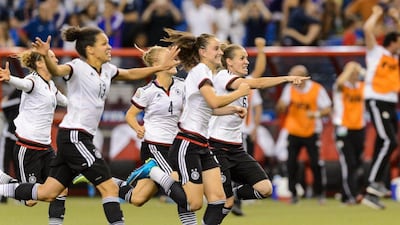 Germany players rush to celebrate after defeating France on penalties to reach the Women's World Cup semi-finals. Minas Panagiotakis / Getty Images / June 26, 2015