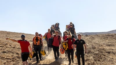 Rescuers arrive at a base camp to take part in a rescue operation to reach U. S. caver Mark Dickey. Reuters
