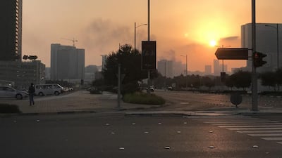 Firefighters are battling a blaze in downtown Abu Dhabi, with police closing part of Hamdan Street shortly before 7pm on Wednesday. Carla Mirza / The National