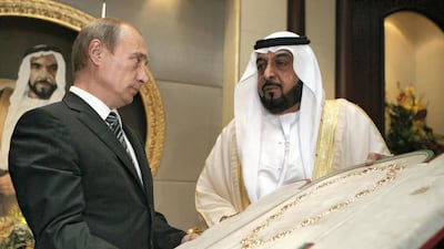Sheikh Khalifa bin Zayed Al Nahayan (R) presents the country's highest award, the Zayed Order, to Russian President Vladimir Putin (L) at the Mushrif Palace in Abu Dhabi. Putin is accompanied on the trip by the director of arms exporter Rosoboronexport, as well as those of the airline Aeroflot and space agency Roskosmos. RIA NOVOSTI / KREMLIN POOL / DMITRY ASTAKHOV / AFP PHOTO / POOL / DMITRY ASTAKHOV