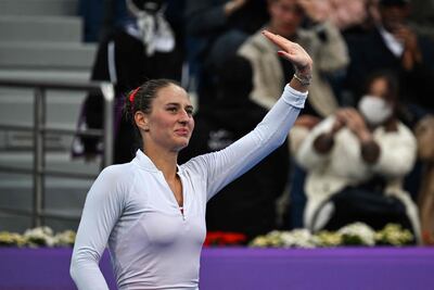 An emotional Marta Kostyuk of Ukraine waves to supporters after beating Coco Gauff at the Qatar Open. AFP