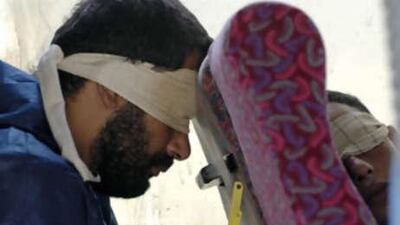 Blindfolded Palestinians, who fled to Israel from Gaza, sit aboard a bus as they are transported by the Israeli army near the Erez Crossing, just outside the northern Gaza Strip.