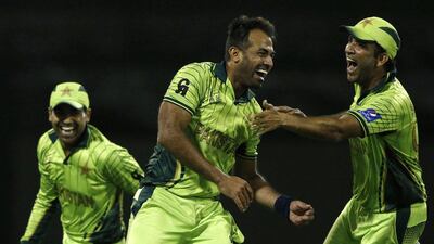 Wahab Riaz, centre, scored 54 with the bat before taking four wickets to help Pakistan defeat Zimbabwe. Jason Reed / Reuters