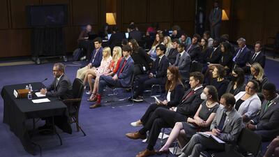A small group listens as Mr Zatko speaks. Getty Images / AFP