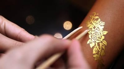 Image The Precious Skin jewellery is made of 99.99 per cent pure gold and platinum foil that is set on bare skin.