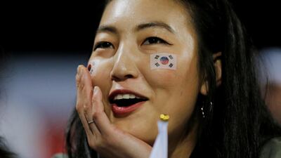 Soccer Football - AFC Asian Cup - Round of 16 - South Korea v Bahrain - Maktoum bin Rashid Al Maktoum Stadium, Dubai, United Arab Emirates - January 22, 2019 A South Korea fan celebrates after the match REUTERS/Thaier Al-Sudani