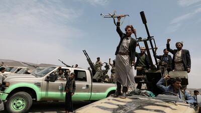 Houthi fighters shout slogans during a gathering of Houthi loyalists on the outskirts of Sanaa, Yemen July 8, 2020. Reuters