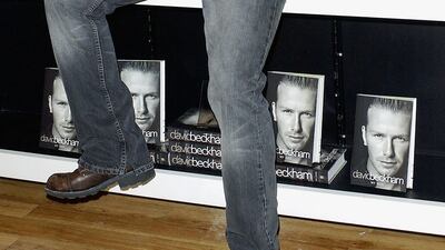 David Beckham, in distressed jeans and a leather jacket, unveils his autobiography at Waterstones on November 17, 2003 in London, England. Getty Images
