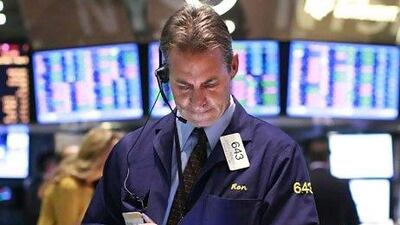 A trader at the New York Stock Exchange. Stock markets from New York to Shanghai took big strides this month. Brendan McDermid / Reuters