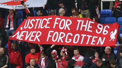Liverpool fans in 2013 hold up banners commemorating those who lost their lives in the 1989 Hillsborough disaster. AFP