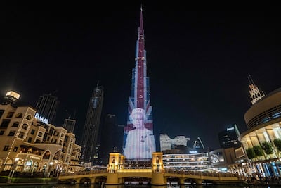 A portrait of Queen Elizabeth is projected upon the Burj Khalifa in Dubai. AFP