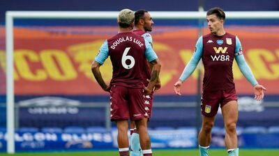 Aston Villa midfielder Jack Grealish, right, reacts after the final whistle at Goodison Park. AFP