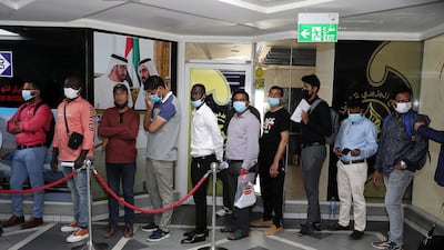 Applicants for jobs as Roads and Transport Authority taxi drivers queue at the Privilege Labour Recruitment Office, in Abu Hail Centre, in Deira, Dubai. Pawan Singh / The National