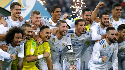 Real Madrid's players celebrate with their trophy after winning the Spanish Super Cup. Francisco Seco / AP Photo