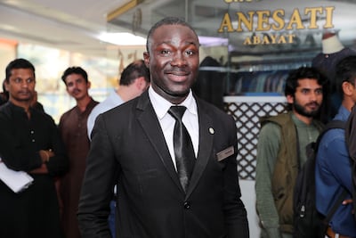 Dauda Rasheed from Nigeria, a former helicopter gunner, hopes to swap his job as a security guard for the steering wheel of a taxi. Pawan Singh / The National