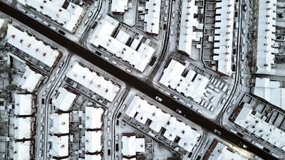 An aerial view of snow covering houses in Birkenhead, north-western England. AFP
