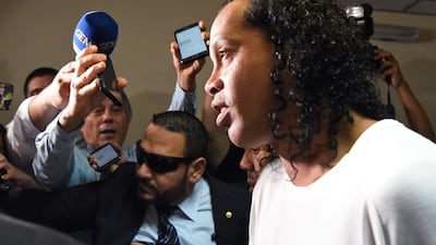 Former Brazil forward Ronaldinho arrives at Asuncion's Justice Palace to testify about his irregular entry to the country, in Asuncion, on March 6, 2020. AFP