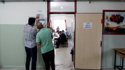 People arrive at a polling station in Yalova, Turkey, on June 24, 2018. Osman Orsal / Reuters