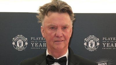 Manchester United manager Louis van Gaal poses for pictures on the red carpet as he arrives to attend the Manchester United club awards ceremony on Tuesday. Oli Scarff / AFP / May 19, 2015