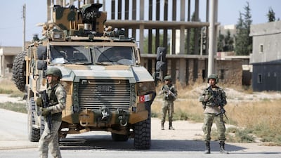 Turkish soldiers patrol the northern Syrian Kurdish town of Tal Abyad, on the border between Syria and Turkey. AFP