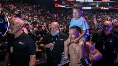 Petr Yan leaves the octagon after his win over Marcus McGhee in a bantamweight fight