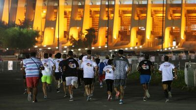 Runners take part in the Abu Dhabi Dash. Pawan Singh / The National