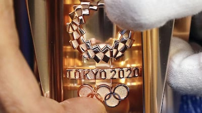 The torch for the 2020 Tokyo Olympics is manufactured at a factory in Tokyo. Kyodo / via Reuters