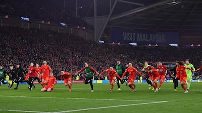Wales' players celebrate victory and qualification for the Euro 2020 finals. AFP