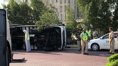 Lorry driver crashes into roundabout, killing a passenger and injuring himself and another. Courtesy Dubai Police