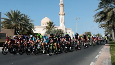 Cyclists ride through Jumeirah during the fourth stage of the cycling race.