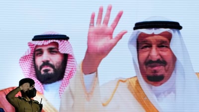 A salute for King Salman and Crown Prince Mohammed bin Salman, depicted on a giant poster. A million Muslims are expected to attend this year's Hajj after two years of pandemic disruption. AP Photo