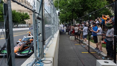 Dennis Hauger drives past fans. AFP