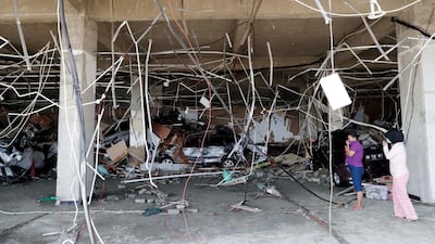 Indonesian women survey a shopping mall in Talise beach, Palu, Central Sulawesi, Indonesia. EPA