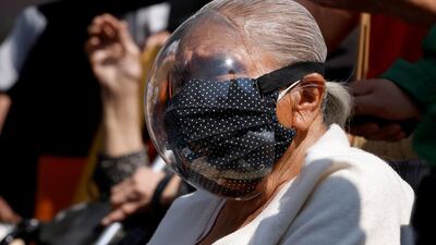 A person waits to receive the Pfizer-BioNTech Covid-19 vaccine during a mass vaccination in Mexico City, Mexico. Reuters