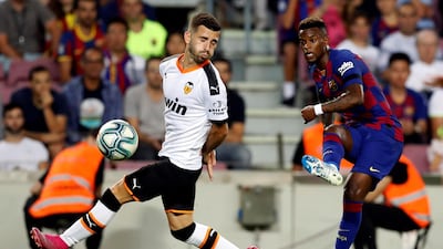 Barcelona's Nelson Semedo in action against Valencia's Jose Gaya. EPA