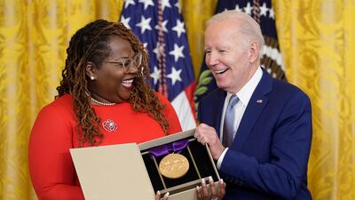 Mr Biden presents the 2021 National Medal of the Arts to Blondel Pinnock on behalf of the Billie Holiday Theatre. AP