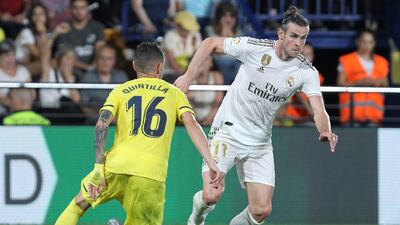 Real Madrid's Gareth Bale, vies withe Villareal's Xavi Quintilla during the Spanish La Liga soccer match between Villarreal and Real Madrid in the Ceramica stadium in Villarreal, Spain. AP