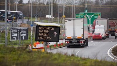 Trucks on the approach road to the Sevington Inland Border facility for customs clearance near Mersham, UK. Bloomberg