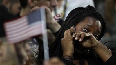 A woman weeps as election results are reported during Democratic presidential nominee Hillary Clinton's election night rally in New York. Frank Franklin II / AP Photo