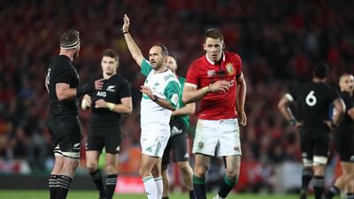 Referee Romain Poite speaks with All Blacks captain Kieran Read as he downgrades a call made in the final minutes from a penalty to a scrum during the Test match against the British & Irish Lions at Eden Park on July 8, 2017 in Auckland, New Zealand.