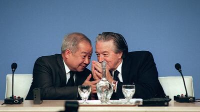 Cambodia's Prince Norodom Sihanouk, left, talks to France's then foreign affairs minister Roland Dumas during the Cambodian Peace Conference in Paris. AFP