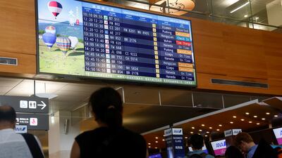 Travellers at the international departures hall of Taipei Songshan Airport wait for flights as Typhoon Gaemi approaches Taiwan. Reuters