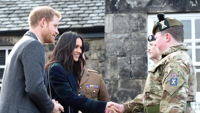 Cadet Colour Sergeant Kyle Laird meets Prince Harry and fiancee Meghan Markle at the Edinburgh Garrison HQ in Scotland. EPA /Mark Owens / British Ministry of Defence