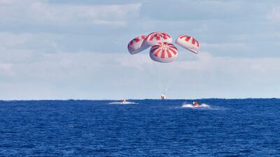 The SpaceX capsule splashes down, in the Gulf of Mexico. AP